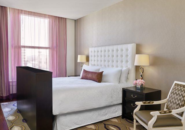 the nines hotel suite guest bedroom